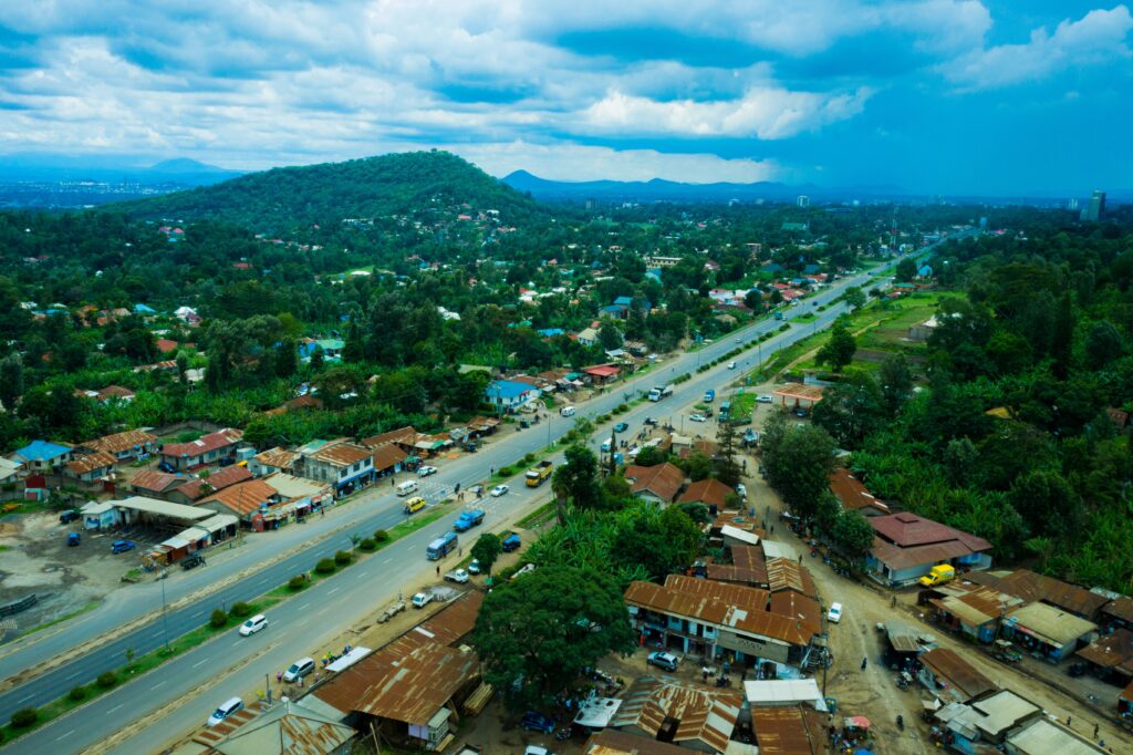 Aerial view of Arusha city with green mountains, Tanzania